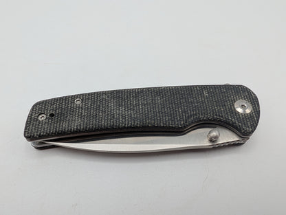 Sencut Crowley Black Micarta – Grade B